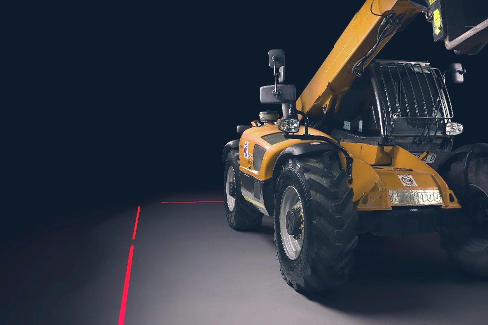 Telehandler with red laser